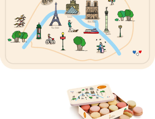 Une boîte décorative dont le couvercle est orné d'une illustration des monuments de Paris s'ouvre, révélant des macarons colorés à l'intérieur. Au-dessus de la boîte se trouve un dessin représentant une carte de Paris avec des sites emblématiques tels que la Tour Eiffel, le Sacré-Cœur et des moulins à vent.